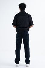 Load image into Gallery viewer, back angle of the straight fit jeans in black