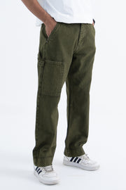 front angle of relaxed fit jeans in green twill